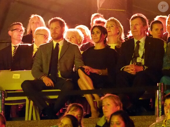 Le prince Harry, duc de Sussex, et Meghan Markle, duchesse de Sussex, enceinte, assistent à la cérémonie d'ouverture des "Invictus Games 2018" à Sydney, le 20 octobre 2018.