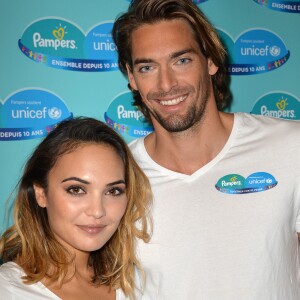 Camille Lacourt et sa femme Valérie Bègue sont les parrain et marraine du 10ème anniversaire du partenariat entre Pampers et l'Unicef pour le vaccin des enfants contre le tétanos. Paris, le 13 novembre 2015.