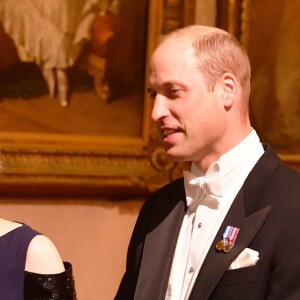 Le prince William, arrivant avec Theresa May, et la duchesse Catherine de Cambridge lors du dîner d'Etat organisé le 23 octobre 2018 en l'honneur du roi Willem-Alexander et de la reine Maxima des Pays-Bas au palais de Buckingham à Londres.