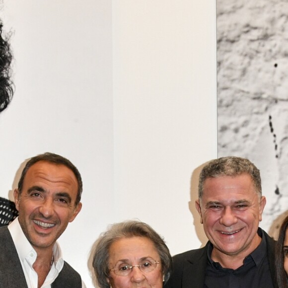 Exclusif - Nikos Aliagas, sa mère Harula Aliagas, Mr Pernelet et sa soeur Maria Aliagas - Nikos Aliagas lance son exposition "L'EPREUVE DU TEMPS - INSTANTS PHOTOGRAPHIQUES" et son livre "L'EPREUVE DU TEMPS" sur le toit de la grande Arche de la Défense à Paris, France, le 25 octobre 2018. © Pierre Perusseau/Bestimage
