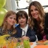 Exclusif - Sophie Thalmann et ses enfants Charlie et Mika lors d'un goûter de Pâques « Tout Chocolat » à l'Hôtel de Vendôme à Paris le 9 avril 2014.