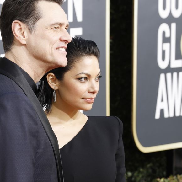 Jim Carrey et sa compagne Ginger Gonzaga au photocall de la 76ème cérémonie annuelle des Golden Globe Awards au Beverly Hilton Hotel à Los Angeles, Californie, Etats-Unis, le 6 janver 2019.