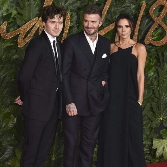 Brooklyn Beckham avec ses parents David Beckham et Victoria Beckham à la soirée British Fashion Awards 2018 au Royal Albert Hall à Londres, le 10 décembre 2018.