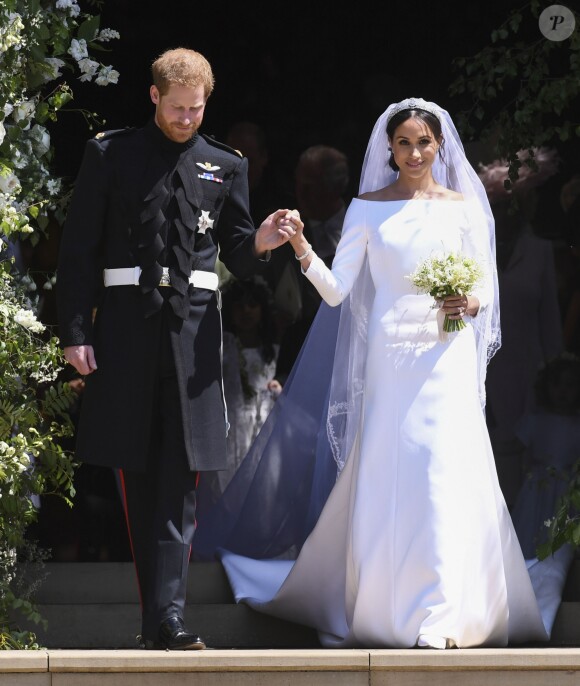Théma - Givenchy habille les mariées royales - Le prince Harry, duc de Sussex, et Meghan Markle, duchesse de Sussex, à la sortie de chapelle St. George au château de Windsor - Sortie après la cérémonie de mariage du prince Harry et de Meghan Markle en la chapelle Saint-George au château de Windsor, Royaume Uni, le 19 mai 2018.