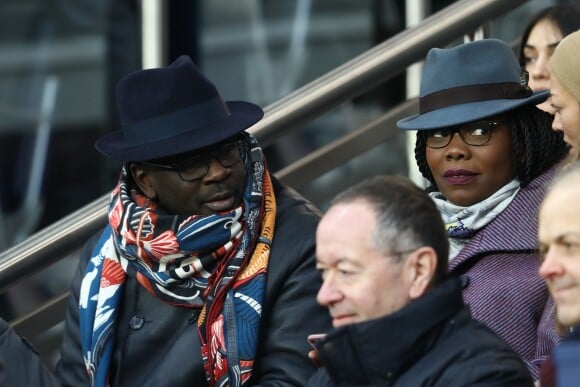 Lilian Thuram et Kareen Guiock - People dans les tribunes du match de football PSG - Guingamp (9-0) au Parc des Princes à Paris le 19 janvier 2019.
