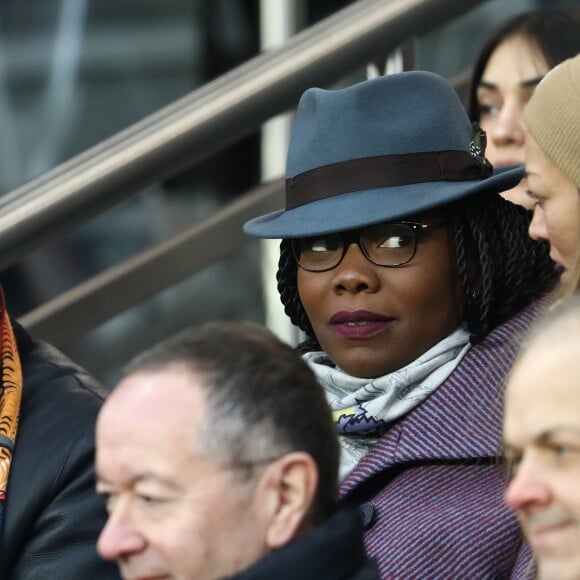 Lilian Thuram et Kareen Guiock - People dans les tribunes du match de football PSG - Guingamp (9-0) au Parc des Princes à Paris le 19 janvier 2019.