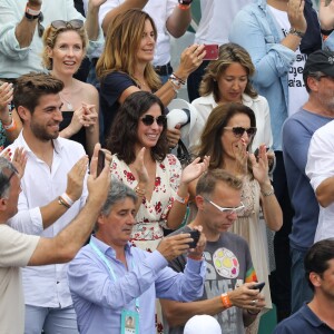 Ana Maria Parera (la mère de R. Nadal), Maria Isabel Nadal (soeur de R. Nadal) avec son compagnon Pep Juaneda et Xisca Perello, la compagne de R. Nadal - Rafael Nadal gagne son onzième Roland-Garros face à D. Thiem à Paris, le 10 juin 2018. © Jacovides/Moreau/Bestimage  Rafael Nadal of Spain is winning his 11th French Open during the trophy ceremony on Day 15 of the 2018 French Open at Roland Garros stadium on June 10, 2018 in Paris, France.10/06/2018 - Paris