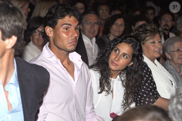 Rafael Nadal et sa compagne Maria Francisca "Xisca" Perello assistent au concert de Julio Iglesias à Barcelone le 26 juin 2013