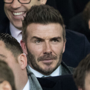 David Beckham dans les tribunes du stade Old Trafford lors du match de 8ème de finale aller de Ligue des champions opposant le Paris Saint-Germain à Manchester United à Manchester, , le 12 février 2019.