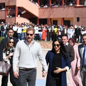 Le prince Harry et Meghan Markle, duchesse de Sussex, enceinte, lors de leur visite au Lycée Qualifiant Grand Atlas à Asni au Maroc, le 24 février 2019.