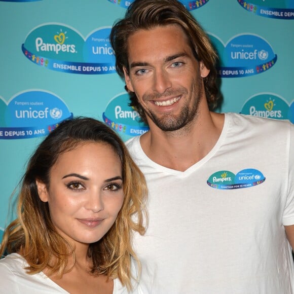 Camille Lacourt et sa femme Valérie Bègue sont les parrain et marraine du 10ème anniversaire du partenariat entre Pampers et l'Unicef pour le vaccin des enfants contre le tétanos, organisé à Paris le 13 novembre 2015.