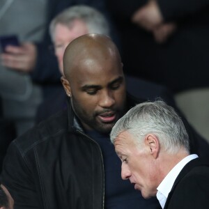 Teddy Riner et Didier Deschamps dans les tribunes du parc des Princes lors du match de 8ème de finale retour de Ligue des champions opposant le Paris Saint-Germain à Manchester Unted à Paris, France, le 6 mars 2019. © Cyril Moreau/Bestimage