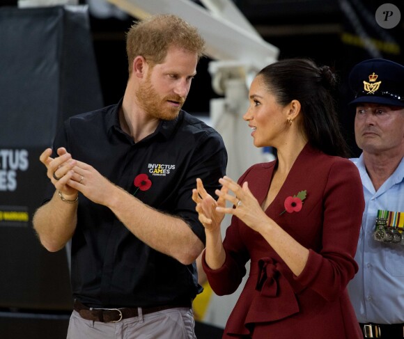 Le prince Harry, duc de Sussex, et Meghan Markle, duchesse de Sussex, enceinte, assistent à la cérémonie de clôture des Invictus Games 2018 à Sydney, le 27 octobre 2018.