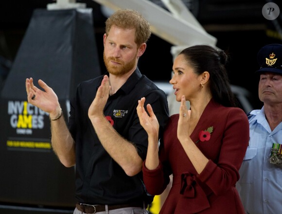 Le prince Harry, duc de Sussex, et Meghan Markle, duchesse de Sussex, enceinte, assistent à la cérémonie de clôture des Invictus Games 2018 à Sydney, le 27 octobre 2018.