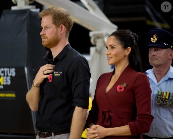 Le prince Harry, duc de Sussex, et Meghan Markle, duchesse de Sussex, enceinte, assistent à la cérémonie de clôture des Invictus Games 2018 à Sydney, le 27 octobre 2018.