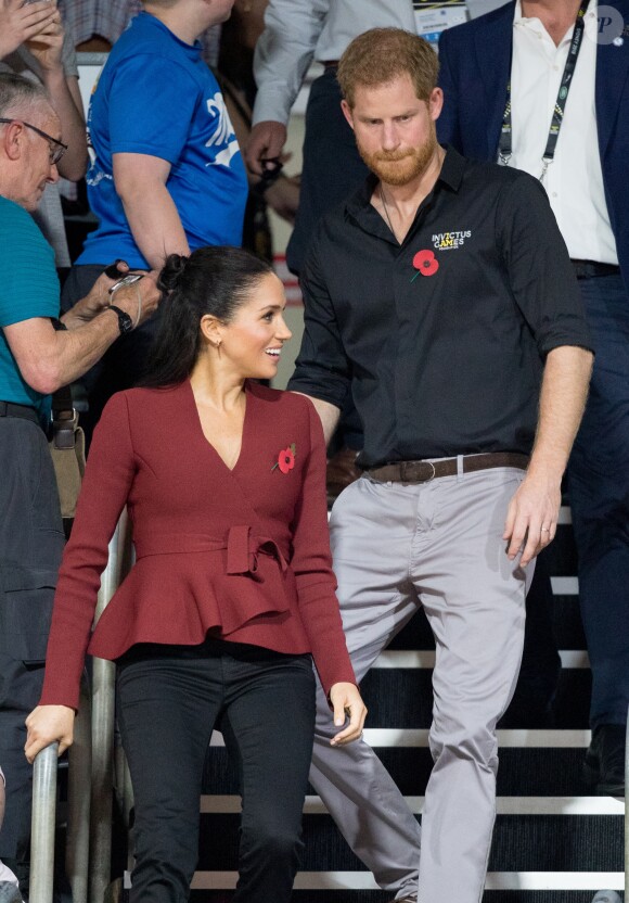 Le prince Harry, duc de Sussex, et Meghan Markle, duchesse de Sussex, enceinte, assistent à la cérémonie de clôture des Invictus Games 2018 à Sydney, le 27 octobre 2018.