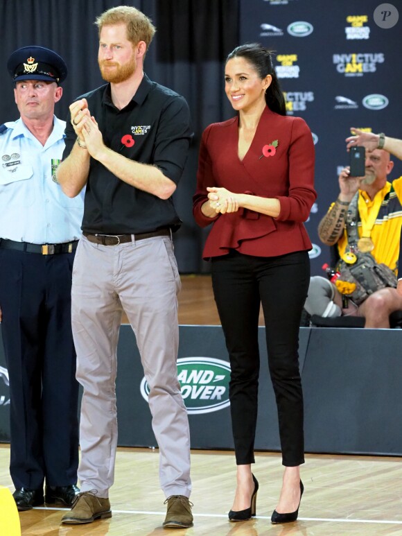 Le prince Harry, duc de Sussex, et Meghan Markle, duchesse de Sussex, enceinte, assistent à la cérémonie de clôture des Invictus Games 2018 à Sydney, le 27 octobre 2018.