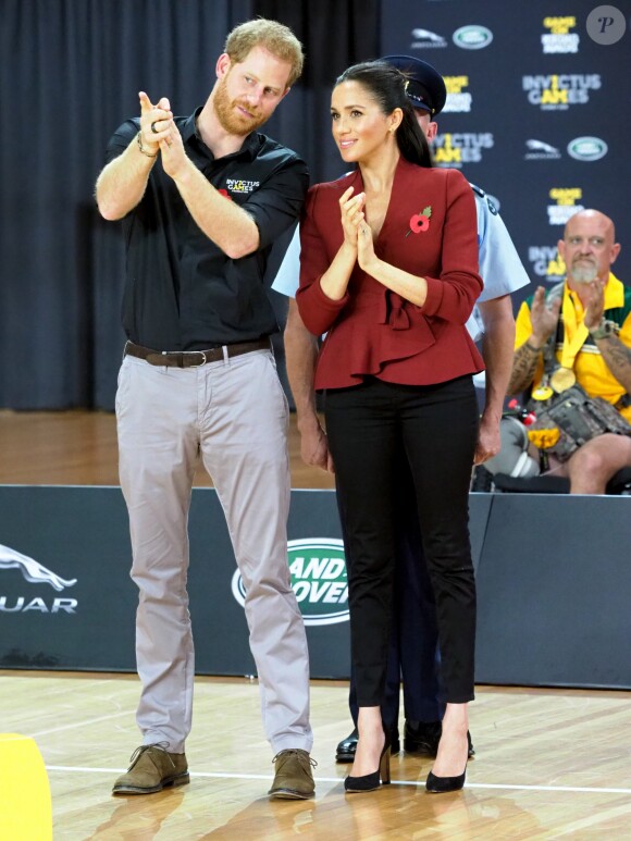 Le prince Harry, duc de Sussex, et Meghan Markle, duchesse de Sussex, enceinte, assistent à la cérémonie de clôture des Invictus Games 2018 à Sydney, le 27 octobre 2018.