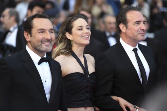 Gilles Lellouche, Marion Cotillard, Jean Dujardin à la première du film "La belle époque" lors du 72ème Festival International du Film de Cannes, France, le 20 mai 2019.