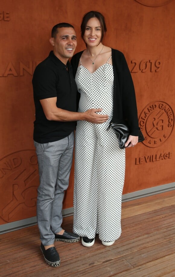 Brahim Asloum et sa compagne (enceinte) au village lors des internationaux de tennis de Roland Garros à Paris le 27 mai 2019. © Dominique Jacovides / Bestimage