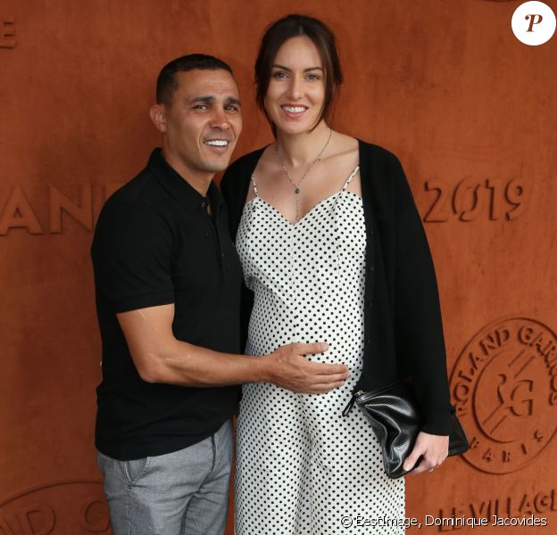 Brahim Asloum et sa compagne (enceinte) au village lors des internationaux de tennis de Roland Garros à Paris le 27 mai 2019. © Dominique Jacovides / Bestimage