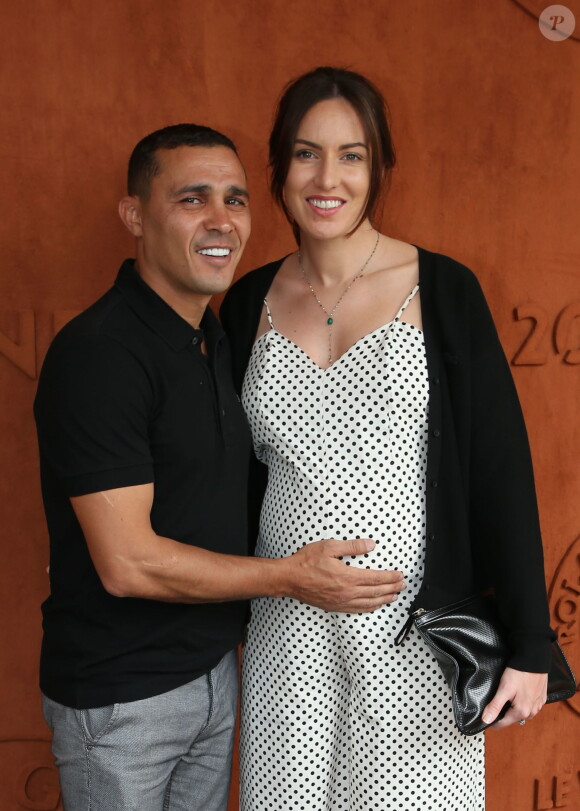 Brahim Asloum et sa compagne (enceinte) au village lors des internationaux de tennis de Roland Garros à Paris le 27 mai 2019. © Dominique Jacovides / Bestimage