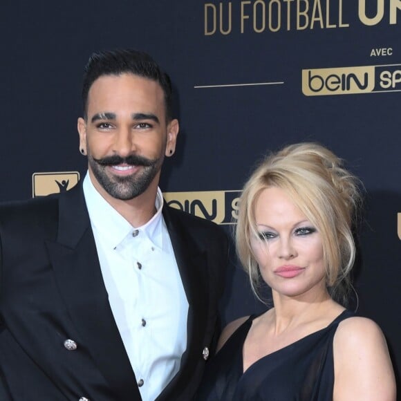 Adil Rami et Pamela Anderson au photocall de la 28ème cérémonie des trophées UNFP (Union nationale des footballeurs professionnels) au Pavillon d'Armenonville à Paris, France, le 19 mai 2019. © Coadic Guirec/Bestimage