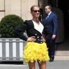 Céline Dion quitte l'hôtel Crillon, vêtue d'une veste et d'une jupe Ronald Van Der Kemp et chaussée en Jimmy Choo. Paris, le 30 juin 2019.