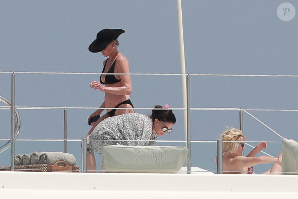 Exclusif - Melanie Griffith en bikini noir sur un yacht lors de ses vacances à Ibiza le 4 juillet 2019.