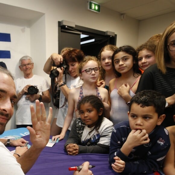 Exclusif - Camille Lacourt participe à une séance dédicaces à la piscine Vallier à Marseille à l'occasion de la 12 ème Nuit de l'Eau. Le 23 Mars 2019.