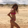 Alexandra Rosenfeld, enceinte de son deuxième enfant, dévoile son baby bump en bikini à la plage le 10 juillet 2019 sur Instagram.