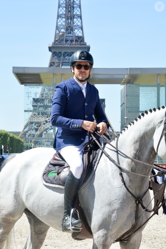 Exclusif - Guillaume Canet pose avec son cheval lors du Longines Paris Eiffel Jumping au Champ de Mars à Paris, le 5 juillet 2019. © Veeren Ramsamy/Bestimage