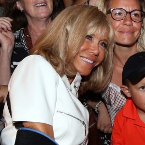 La Première dame Brigitte Macron (avec une attelle au bras droit), prend un bain de foule à l'issue des commémorations du 75ème anniversaire de la libération de la ville de Bormes-les-Mimosas, lors du débarquement de Provence. Bormes-les-Mimosas, le 17 août 2019. © Dominique Jacovides/Bestimage