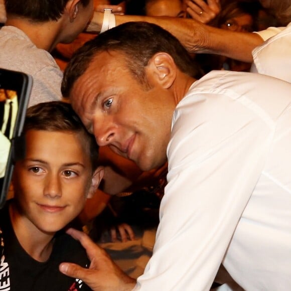 Emmanuel Macron, président de la République Française, en compagnie de François Arizzi (maire de Bormes-les-Mimosas) prend un bain de foule à l'issue des commémorations du 75ème anniversaire de la libération de la ville de Bormes-les-Mimosas, lors du débarquement de Provence. Bormes-les-Mimosas, le 17 août 2019. © Dominique Jacovides/Bestimage