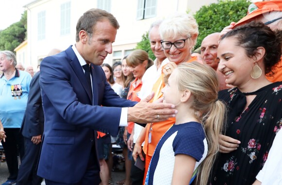 Emmanuel Macron, président de la République Française, prend un bain de foule à l'issue des commémorations du 75ème anniversaire de la libération de la ville de Bormes-les-Mimosas, lors du débarquement de Provence. Bormes-les-Mimosas, le 17 août 2019. © Dominique Jacovides/Bestimage