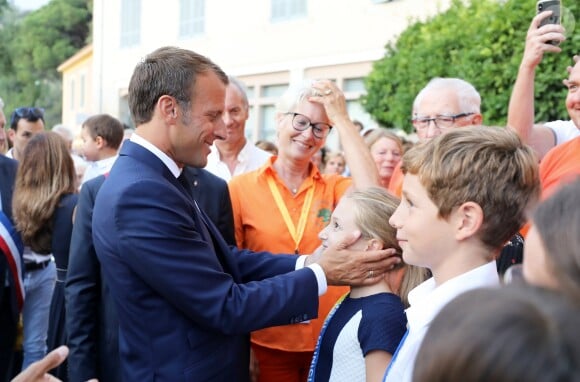 Emmanuel Macron, président de la République Française, prend un bain de foule à l'issue des commémorations du 75ème anniversaire de la libération de la ville de Bormes-les-Mimosas, lors du débarquement de Provence. Bormes-les-Mimosas, le 17 août 2019. © Dominique Jacovides/Bestimage