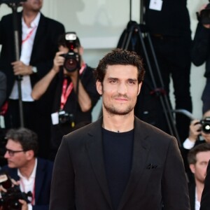 Emmanuelle Seigner, Jean Dujardin et Louis Garrel assistent à la projection du film "J'accuse !" lors du 76ème festival du film de Venise. Le 30 août 2019.