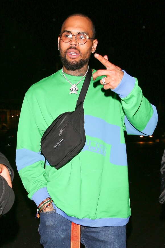 Chris Brown est allé faire la fête avec une jolie inconnue chez Poppy à West Hollywood, le 5 avril 2018