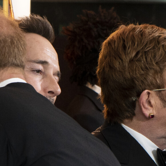 Le prince Harry, duc de Sussex, et Meghan Markle, duchesse de Sussex, avec Elton John et son mari David Furnish à la première du film "Le Roi Lion" au cinéma Odeon Luxe Leicester Square à Londres, le 14 juillet 2019.