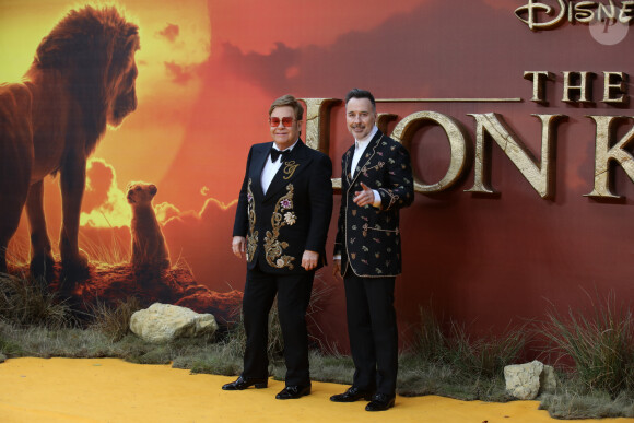 Elton John et son mari David Furnish à la première du film "Le Roi Lion" au cinéma Odeon Luxe Leicester Square à Londres, le 14 juillet 2019.