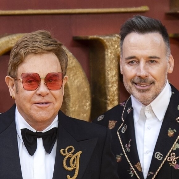 Elton John et son mari David Furnish à la première du film "Le Roi Lion" au cinéma Odeon Luxe Leicester Square à Londres, le 14 juillet 2019.