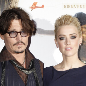 Johnny Depp et Amber Heard à l'avant-première de Rhum Expressau Gaumont Marignan à Paris en novembre 2011.