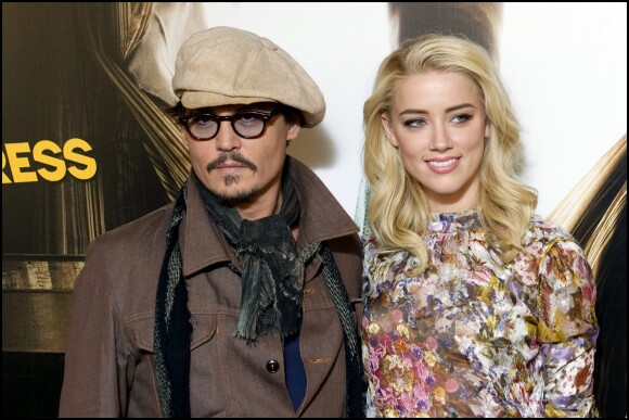 Johnny Depp et Amber Heard au photocall du film "Rhum Express" à Paris le 8 novembre 2011.