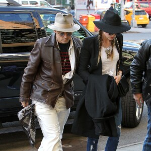 Johnny Depp et sa fiancée Amber Heard arrivent à leur hôtel à New York, le 21 avril 2014.