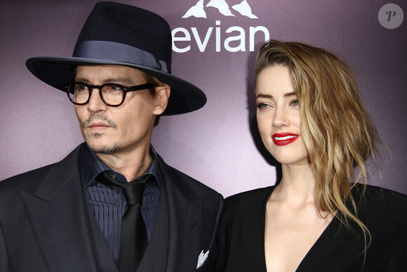Johnny Depp et sa fiancée Amber Heard à la première du film "3 Days to Kill" à Hollywood, le 12 février 2014.