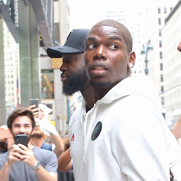 Exclusif - Paul Pogba arrive accompagné de sa femme Maria Salaues, de leur fils et d'autres membres de sa famille dans le magasin 'Adidas' sur la 5ème Avenue à New York, le 2 juillet 2019.