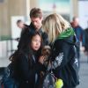 Joy et sa grand-mère Françoise Thibaut, la mère de Laeticia Hallyday - Laeticia Hallyday arrive en famille avec ses filles et sa mère à l'aéroport Roissy CDG le 19 novembre 2019.