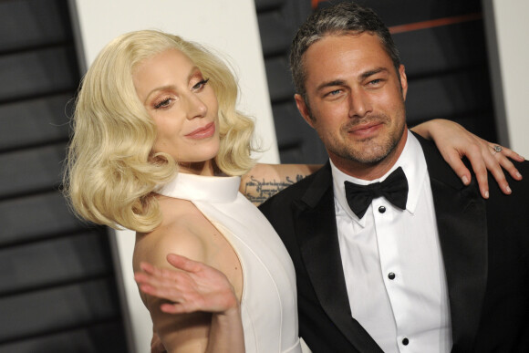 Lady Gaga et son ex-compagnon Taylor Kinney à la soirée "Vanity Fair Oscar Party" après la 88ème cérémonie des Oscars à Hollywood, le 28 février 2016.