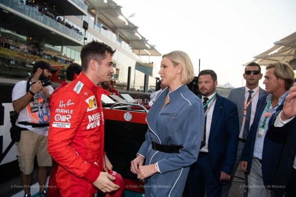 Charlene de Monaco et le pilote de Formule 1 Charles Leclerc lors du Grand-Prix d'Abu Dhabi, le 1er décembre 2019. 
