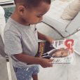 Booba partage une photo de son fils Omar, tenant une couverture de lui pour "GQ". Décembre 2016.
